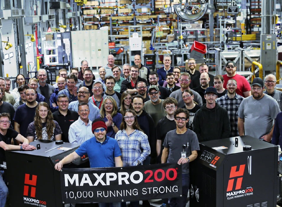 Hypertherm associates gathered around the 10,000th MAXPRO200 plasma power source built at the Hypertherm factory